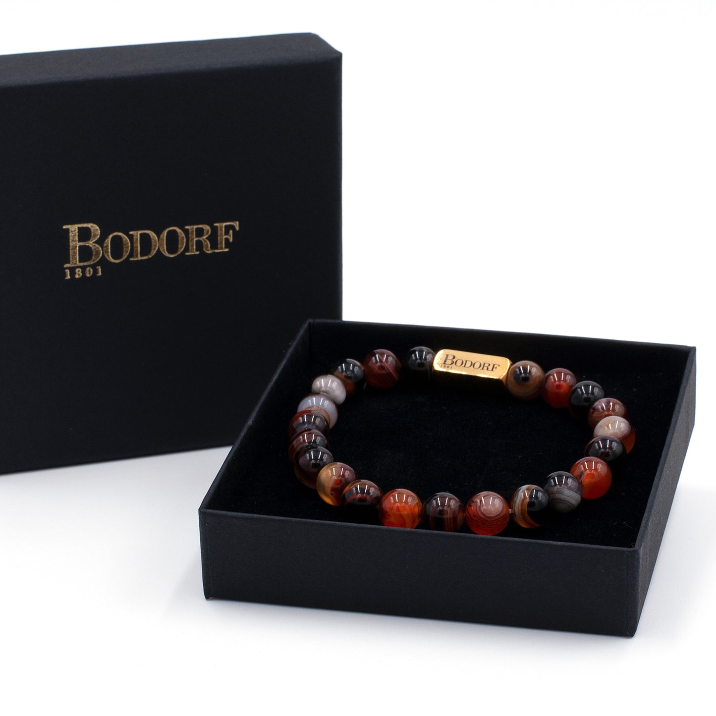Bodorf armband van gepolijste roodbruine gemarmerde agaten met nuances van grijs, zwart, oranje en goud.